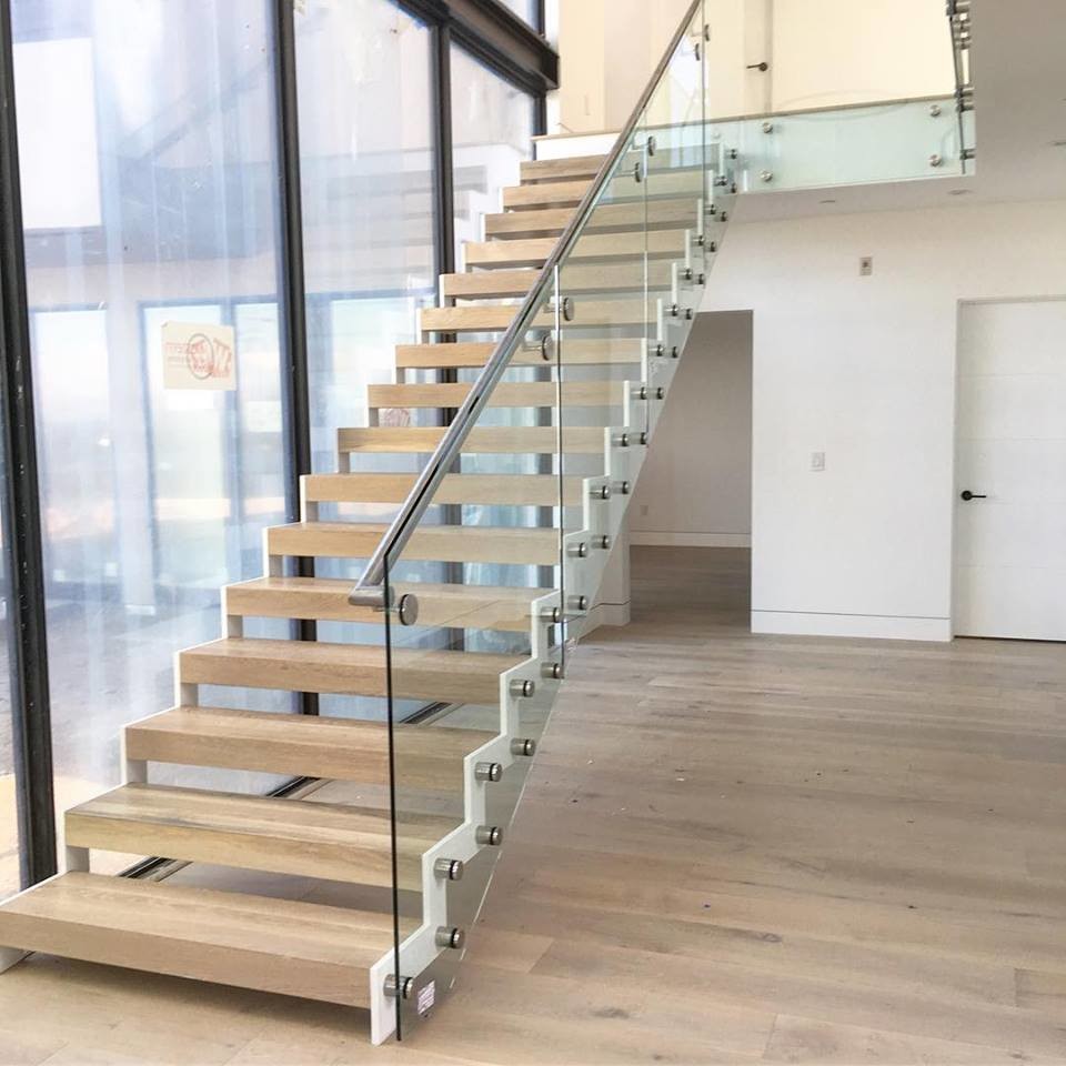  Modern design steel structure staircase with side mounted glass balustrade Manufactures