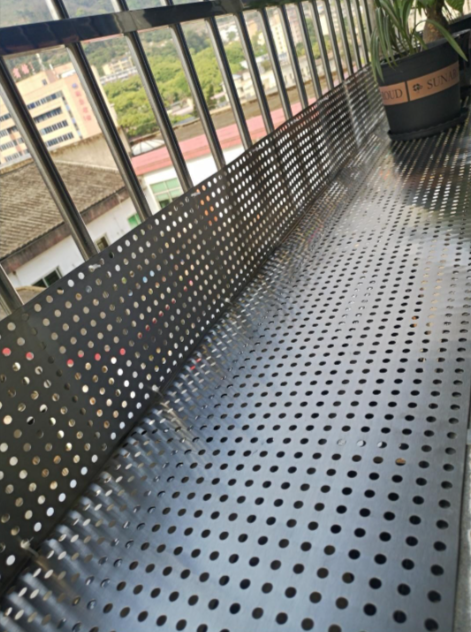 Close-up view of perforated wire mesh pattern and texture