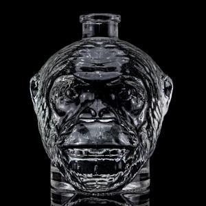 China Unique Design 500ml 750ml Monkey Head Shaped Glass Bottle for Vodka Liquor With Cork on sale